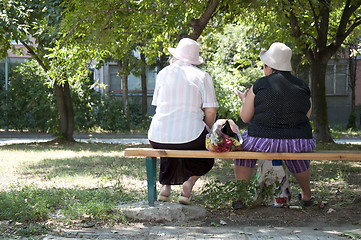 Image showing Two elderly womens seated on a bench