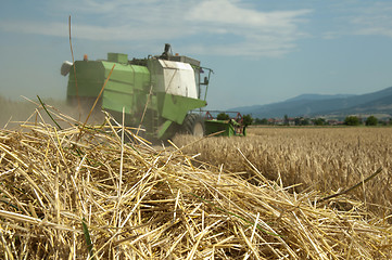 Image showing Tractor and combine harvesting