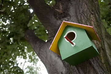 Image showing Home-made bright colored bird house 