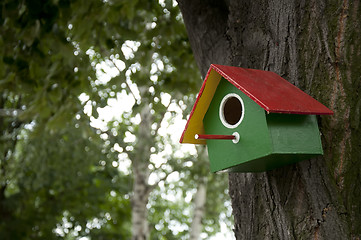 Image showing Home-made bright colored bird house 