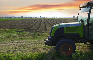 Image showing Plowed land and tractor