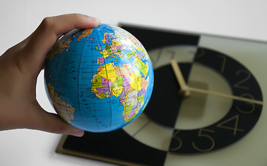 Image showing Globe and watch on background