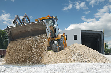 Image showing Excavator unload gravel