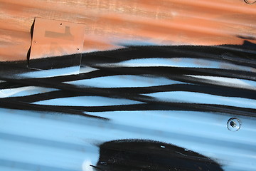 Image showing Corrugated iron with graffiti