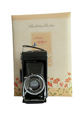Image showing Photo album and vintage camera