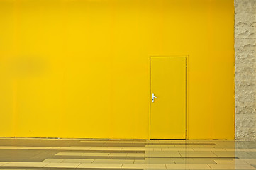 Image showing Yellow wall with a door