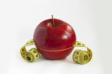 Image showing Tape Measure with red Apple