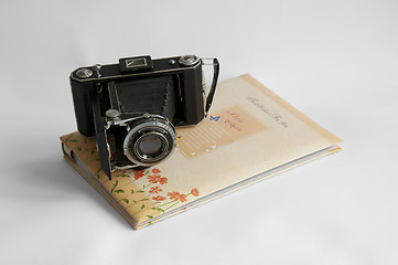 Image showing Photo album and vintage camera
