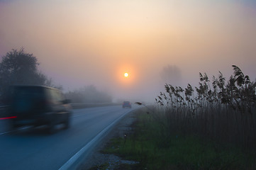 Image showing Blurred car, early morning sunrise