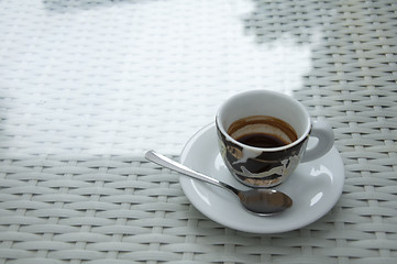 Image showing Cup of coffee on white table. 