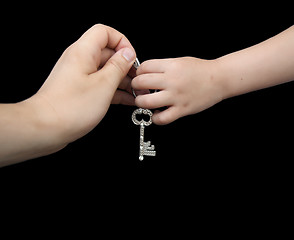 Image showing Father giving key to son