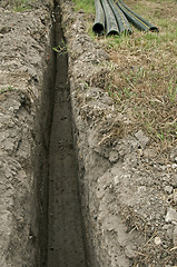 Image showing Plastic pipes in a ditch