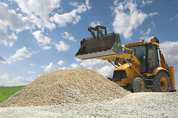 Image showing Excavator to a pile of rubble