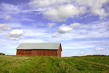 Image showing Country landscape with red barn