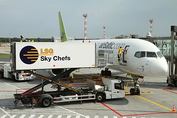 Image showing Air Baltic plane getting new supplies