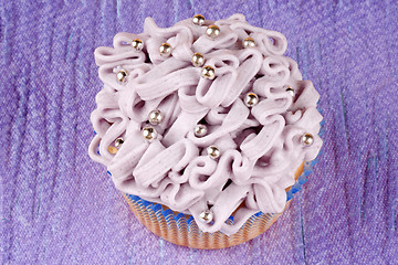 Image showing Fancy light purple cupcake