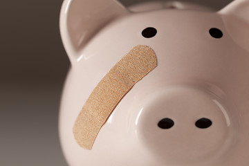 Image showing Piggy Bank with Bandage on Face