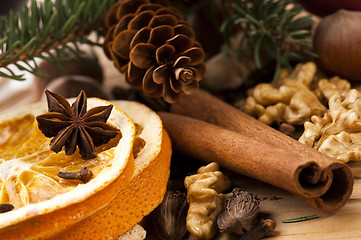 Image showing Different kinds of spices, nuts and dried oranges - christmas de