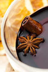 Image showing Mulled wine with slice of orange and spices.