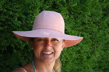 Image showing Beautiful girl in pink hat