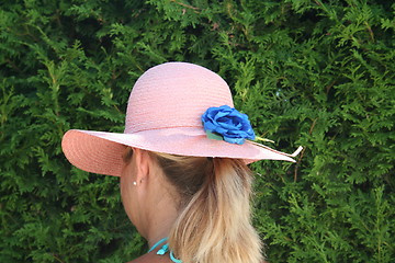 Image showing Girl with pink hat and pony-tail