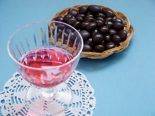 Image showing Glass of liquor and sweet