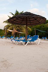 Image showing Beach chairs and umbrella