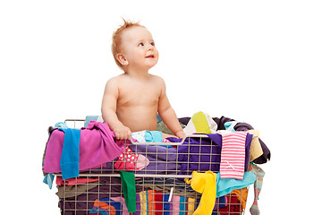Image showing Baby in basket with clothes