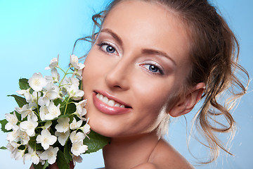 Image showing Beauty portrait and jasmine  flowers