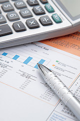 Image showing Stock chart with calculator,pen