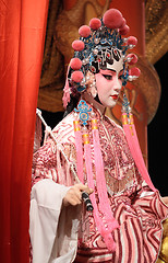 Image showing chinese opera dummy and red cloth as text space ,it is a toy,not