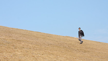 Image showing man walking on the mountain