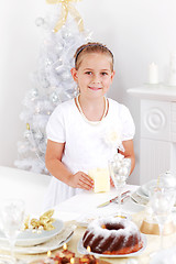 Image showing Girl setting table