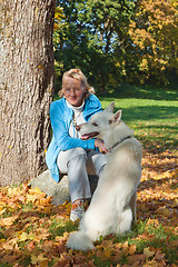 Image showing The woman with a dog in autumn park