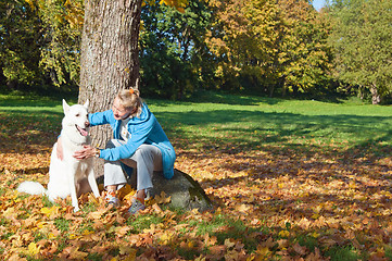 Image showing The woman with a dog in autumn park