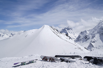 Image showing Snowboards against the top of mountain