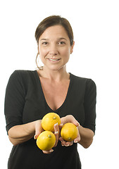 Image showing woman offering fresh lemons