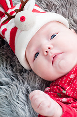 Image showing Little cute baby in red