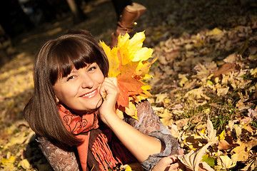 Image showing woman with autumn leaves