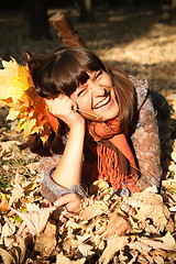 Image showing woman with autumn leaves