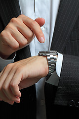 Image showing men's hand with a watch. 