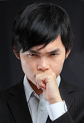 Image showing asian man thinking