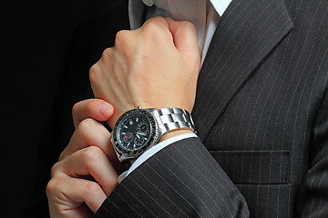 Image showing men's hand with a watch. 