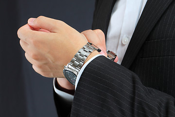 Image showing men's hand with a watch. 