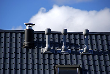 Image showing Pipes, tile and  sky