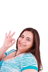 Image showing young happy woman giving ok hand sign