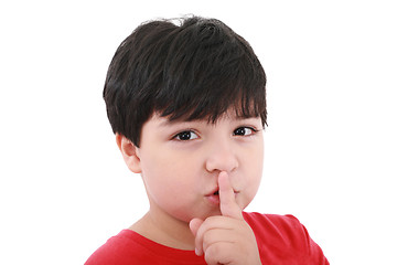 Image showing shh. secret - Young boy with his finger over his mouth 