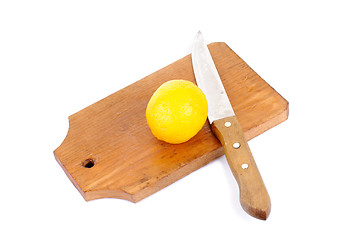 Image showing Lemon and cutting board and knife , isolated on white background 