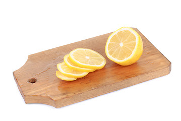 Image showing Lemon and  cutting board  , isolated on white background 