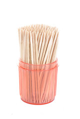 Image showing bunch of toothpicks in a red  plastic container isolated on white background 